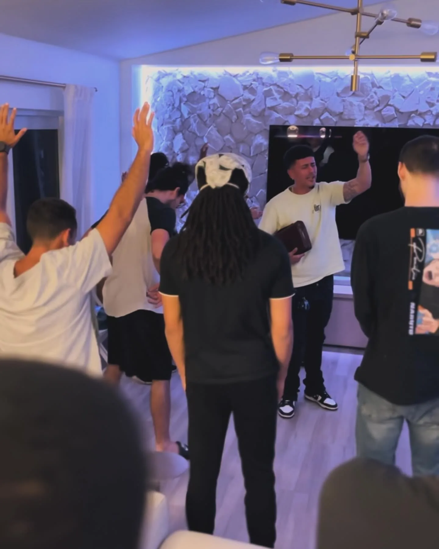 Corporate worship with hands raised